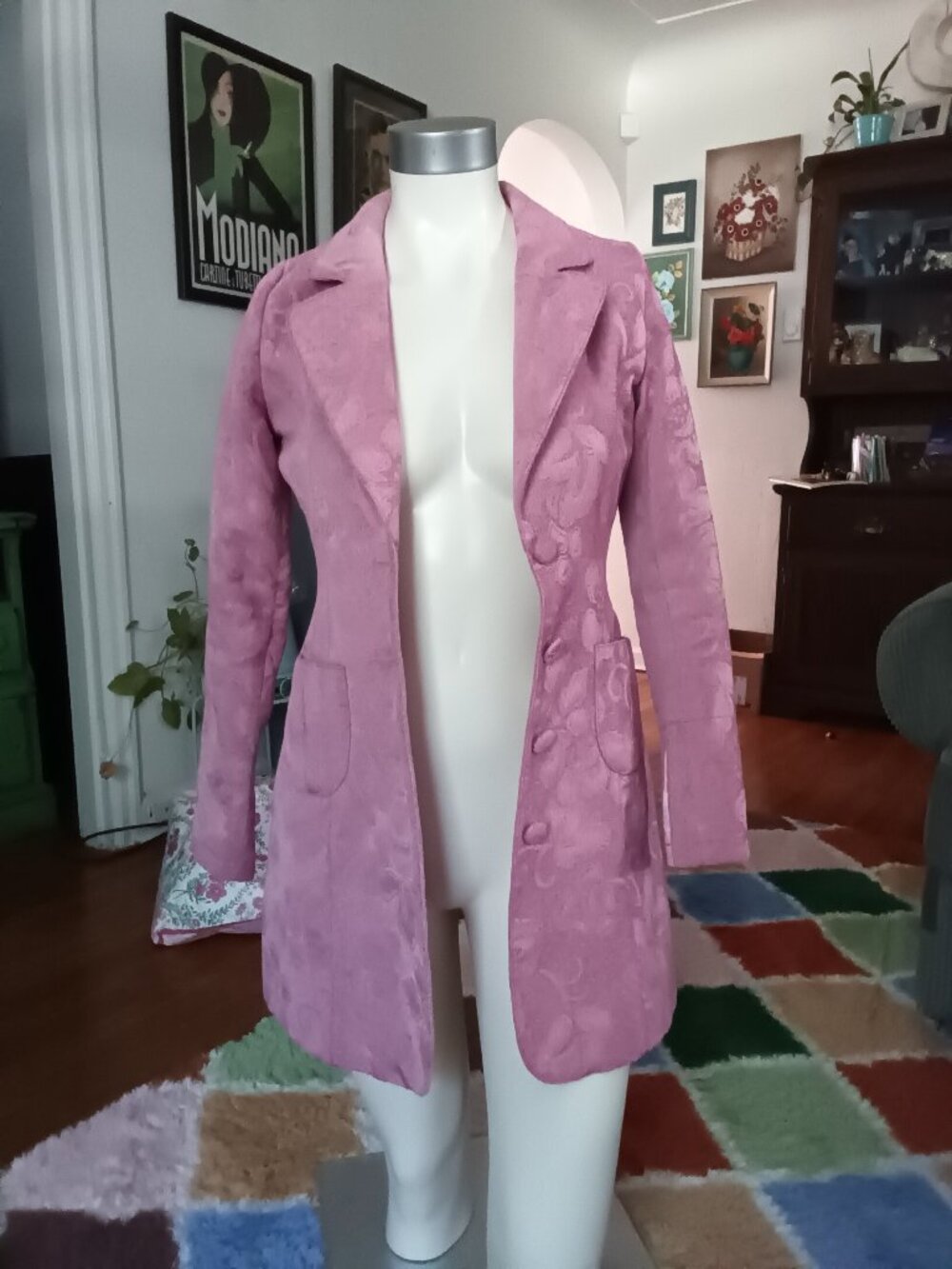 Tulle from Anthropologie pink brocade button front coat with floral pattern.